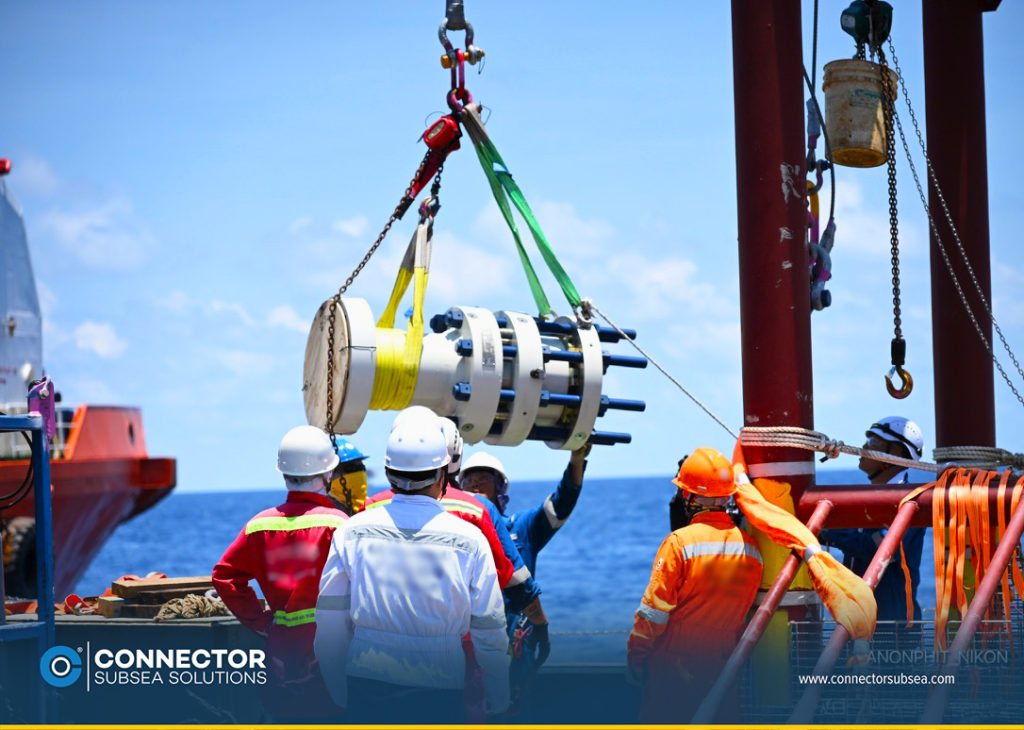 PAPS technicians with CSS remote support guide a MORGRIP® Collet Connector into place during a subsea pipeline repair in the Gulf of Thailand 